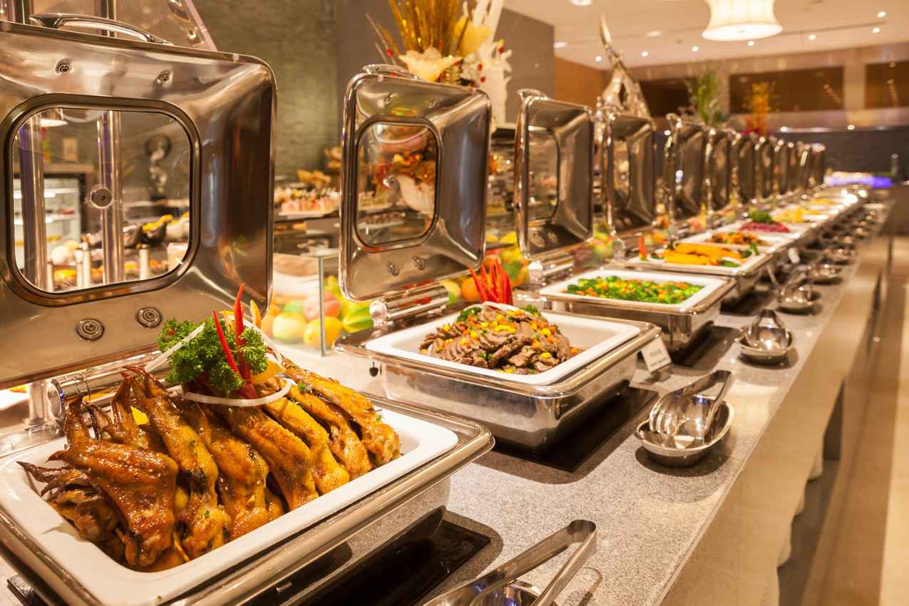 An array of many different dinner options at an all-you-can-eat buffet.