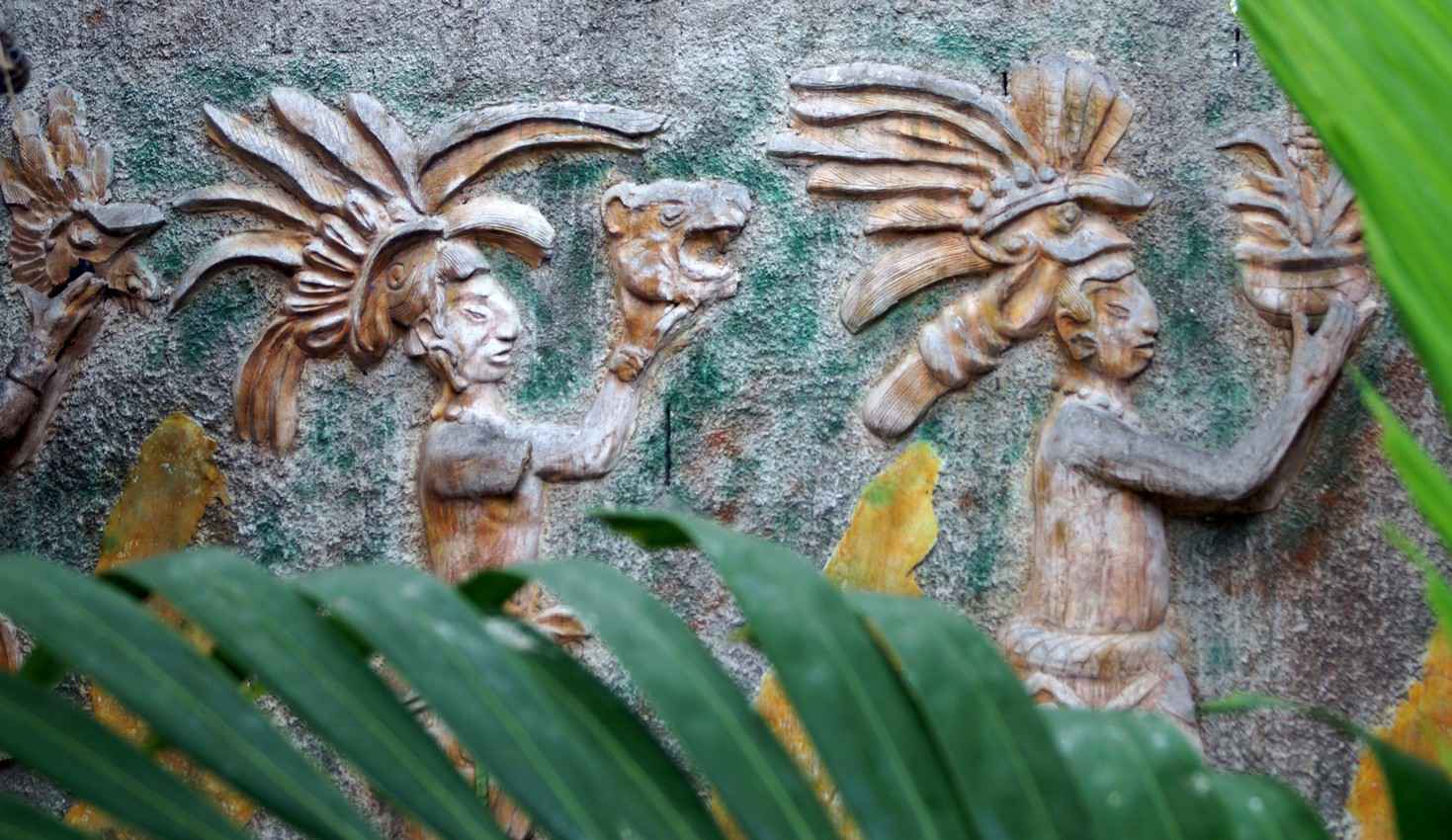 Mayan artwork on the wall of a restaurant in Playa Del Carmen.