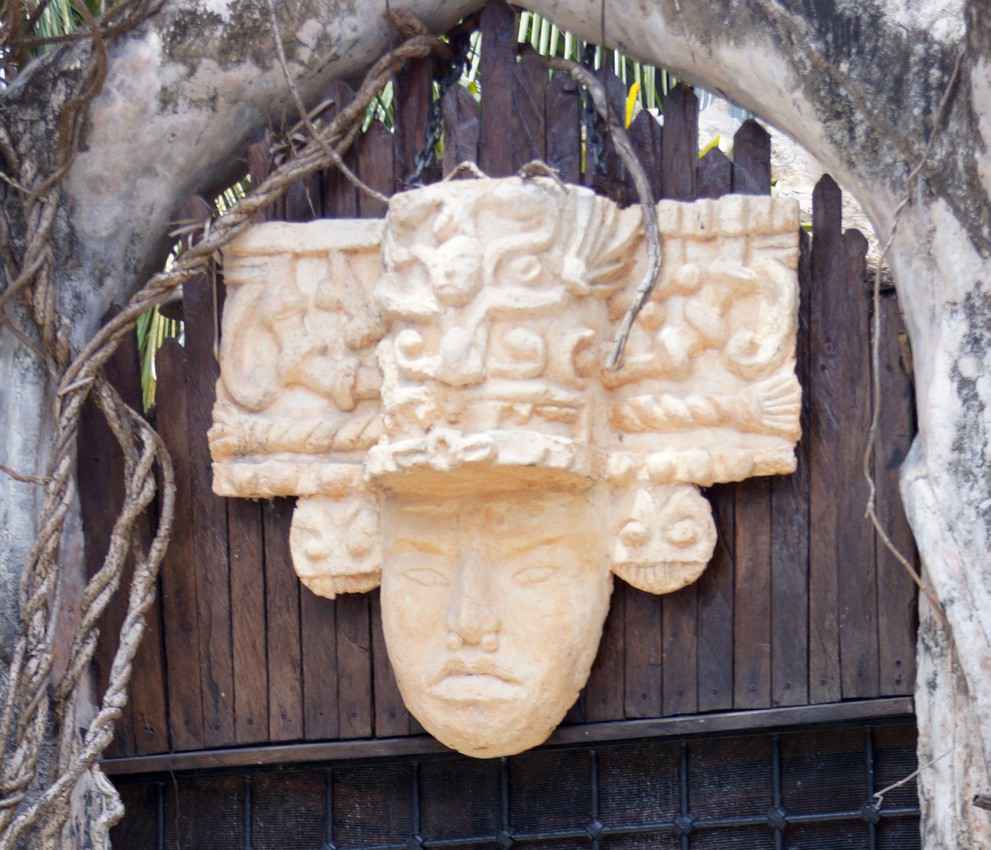 A Mayan warrior headdress sculpture that can be seen above the door of a Playa Del Carmen restaurant.