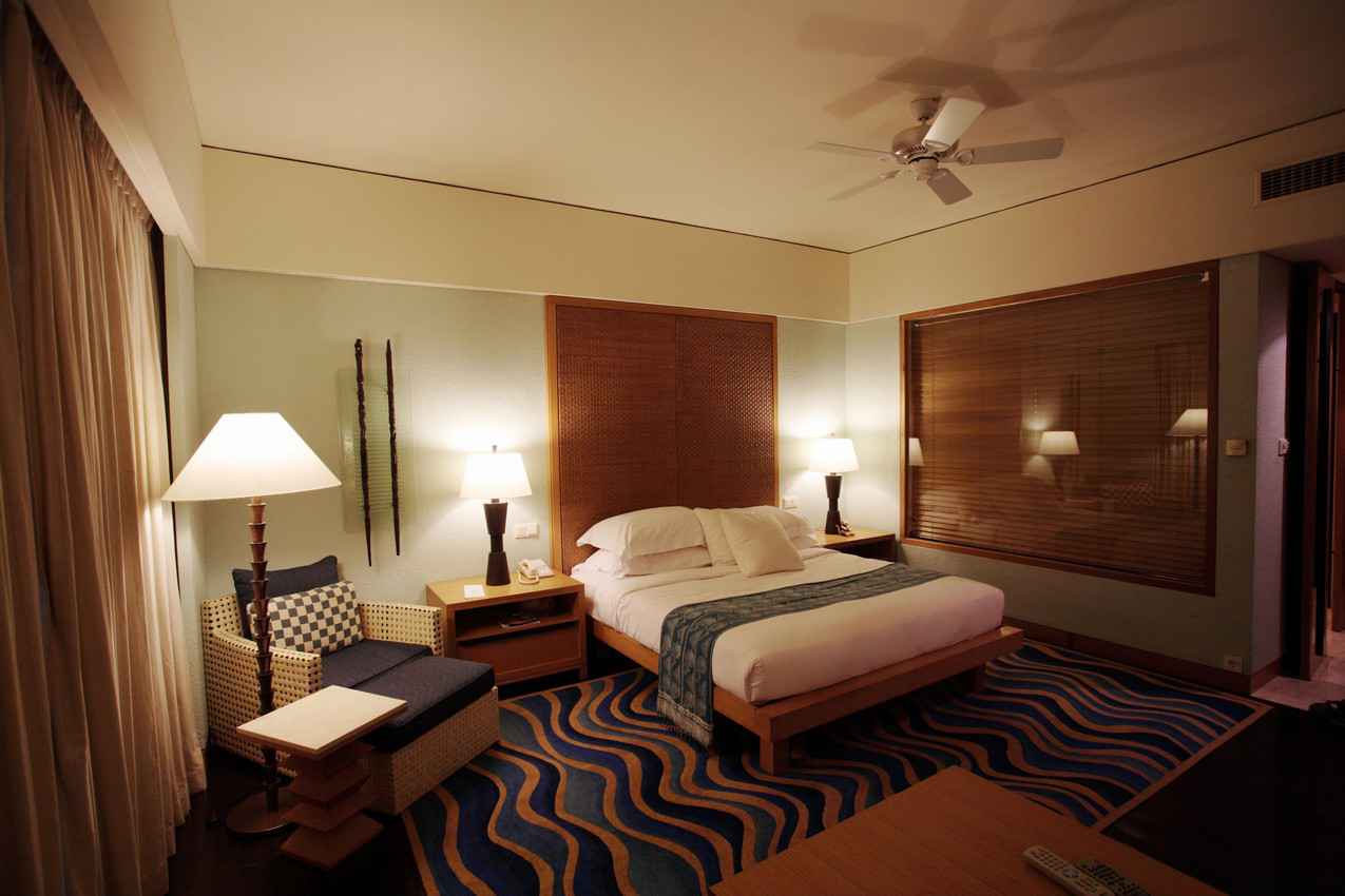 A large and luxurious hotel room.