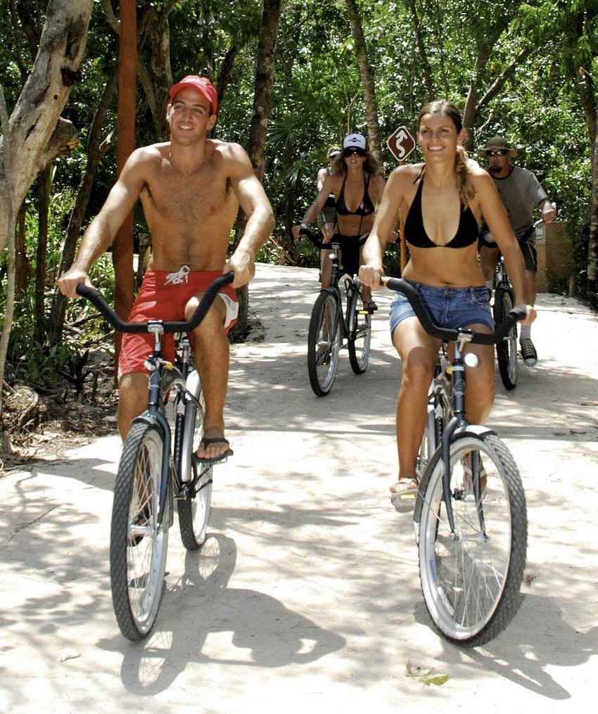 Several people on bikes during a jungle tour.