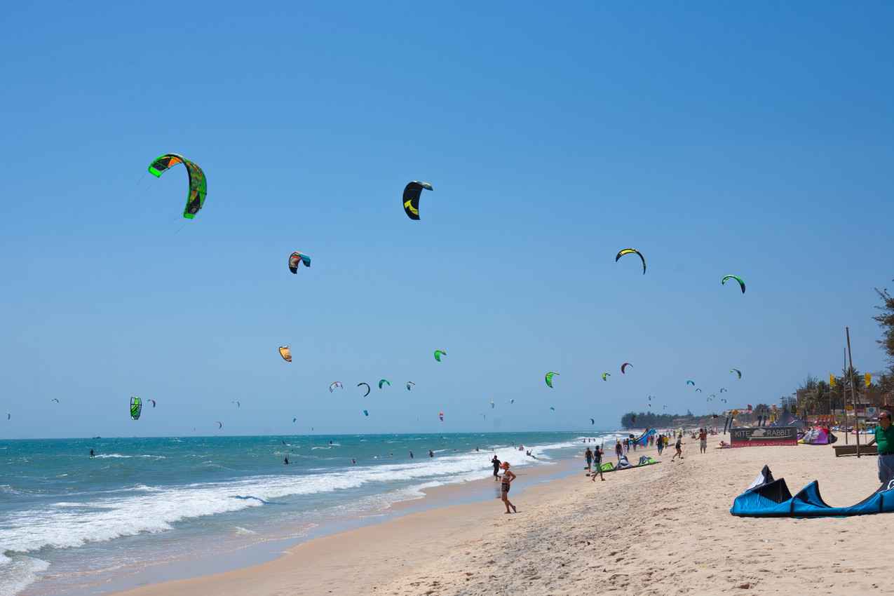 The southern beach of Playa Del Carmen crowded with kite boarders.