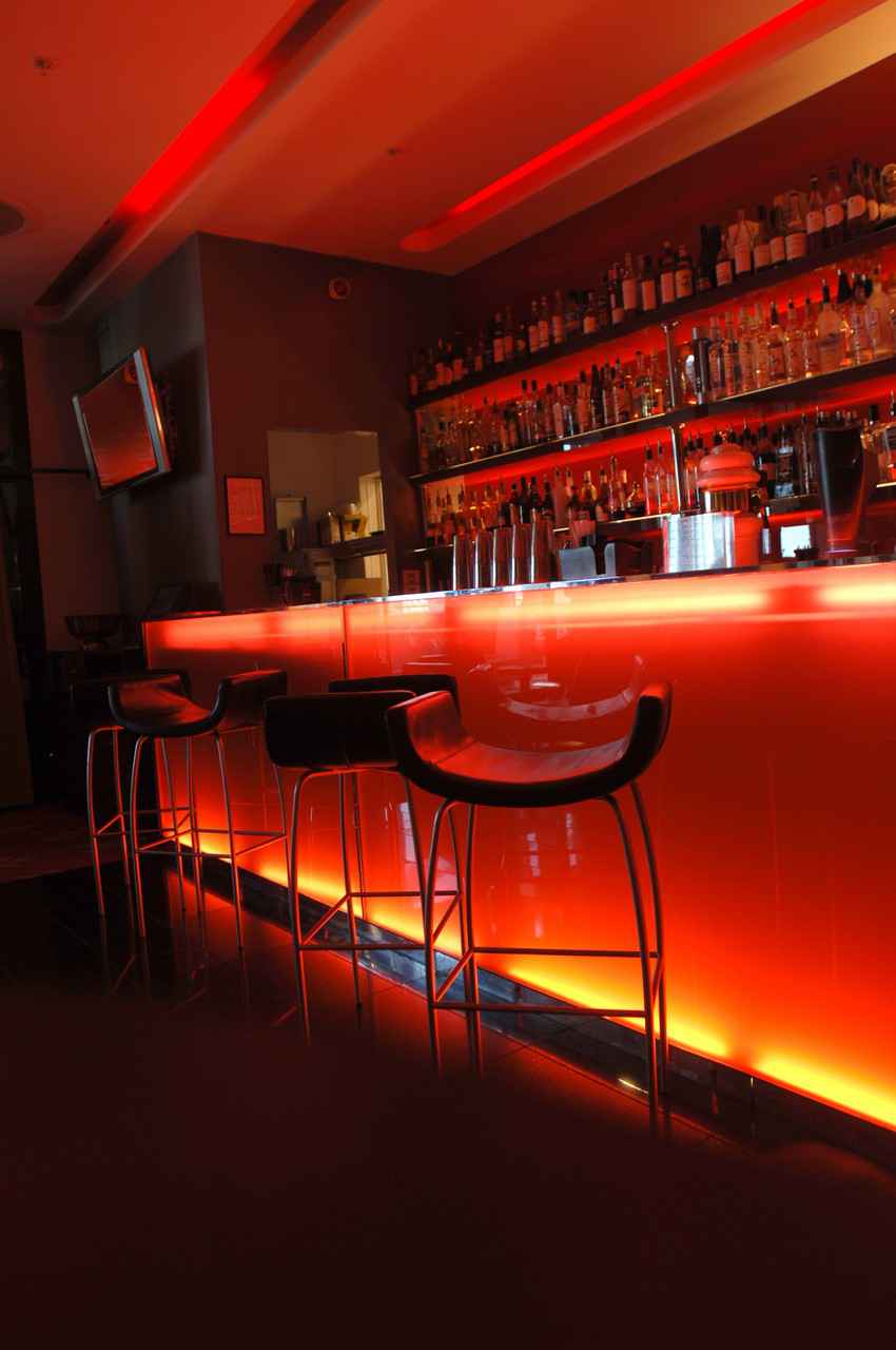 A beautifully designed and neon lit bar.