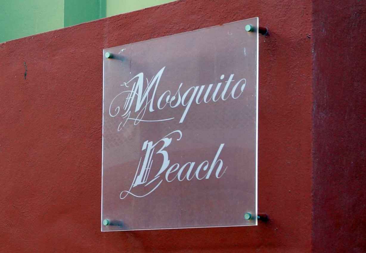 A Mosquito Beach Club sign.