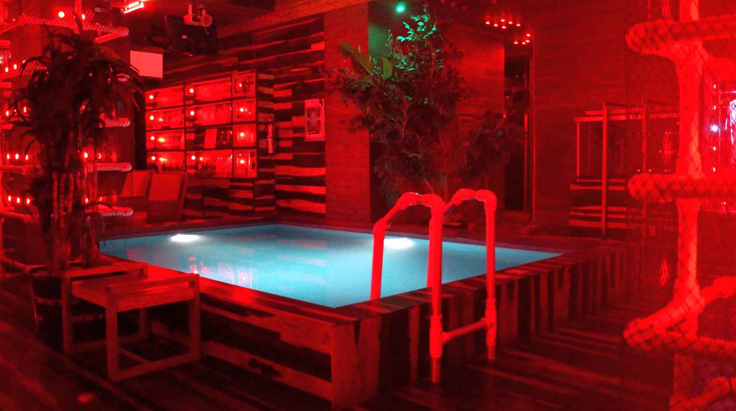 The red room in one of the local Playa Del Carmen bars with a small swimming pool.