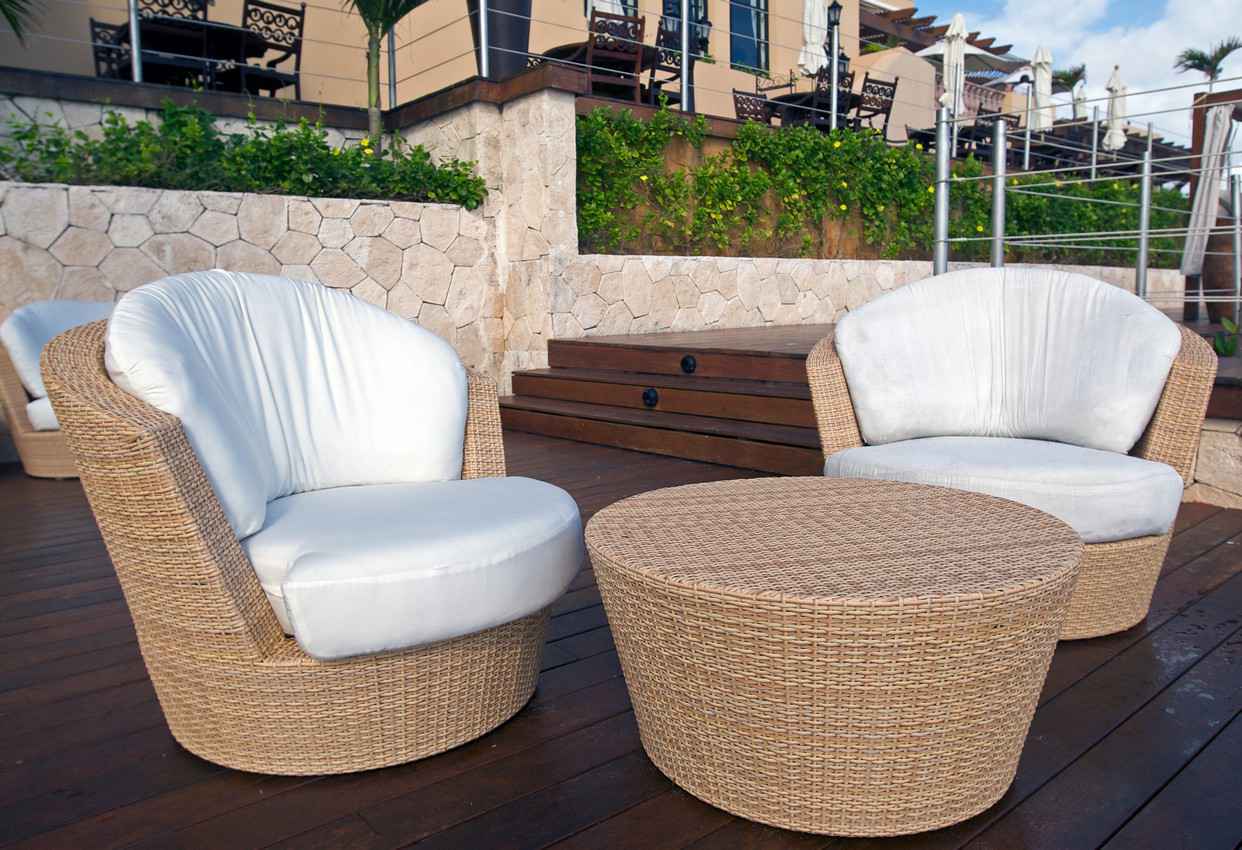Two extremely comfortable chairs on a condo balcony.