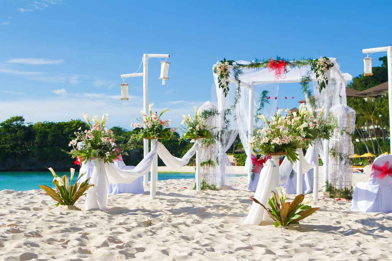 The preparation that takes place for a tropical wedding ceremony.