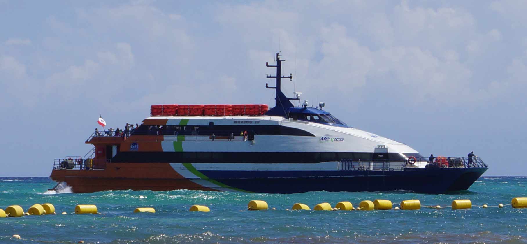 A ferry that is just getting ready to dock in Playa Del Carmen.
