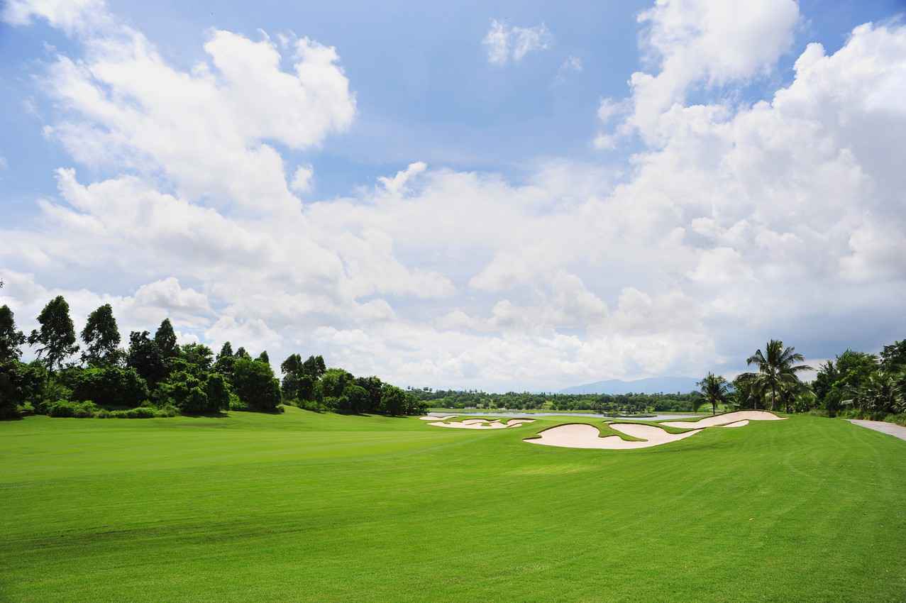 A long stretch of a golf course that is close to Playa Del Carmen.