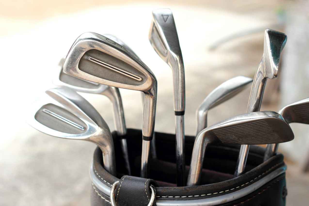 A set of golf clubs and golf bag.
