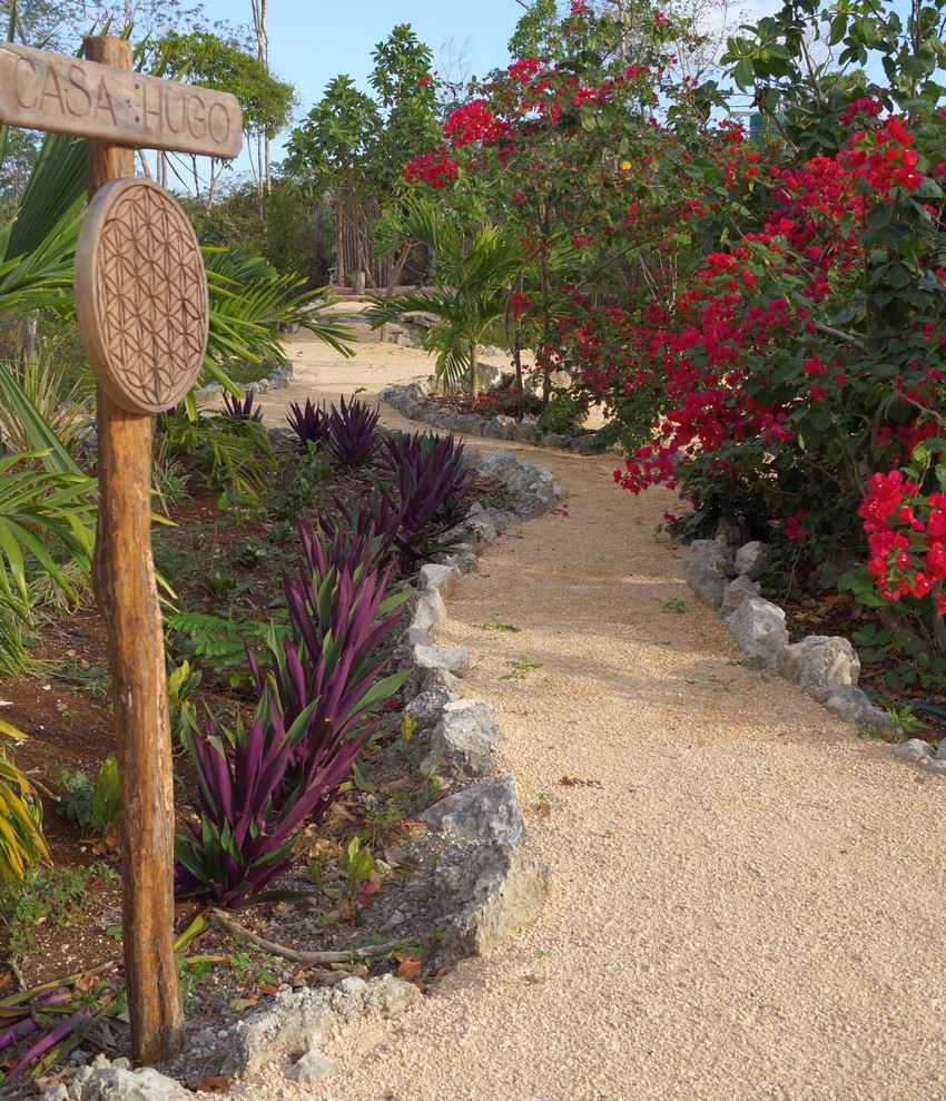 A garden walkway on a strip of land in the Riviera Maya.