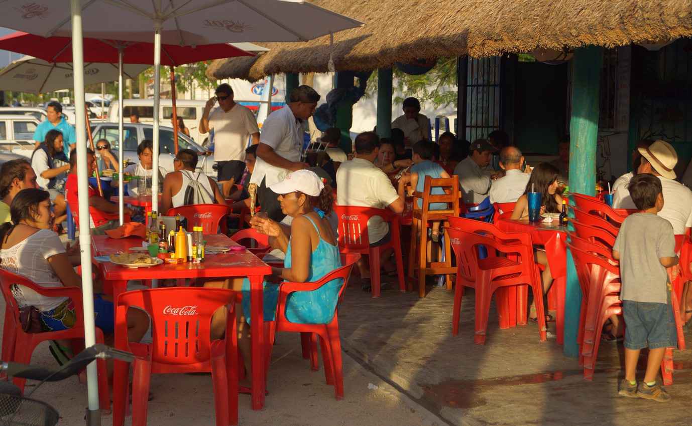 A small seafood restaurant near Playa Del Carmen at sunset.