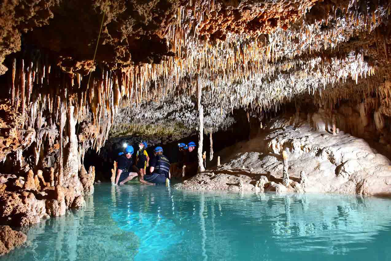 group-of-insane-tourists-lost-in-rio-secreto-tulum-cave-standing-in-deep-water