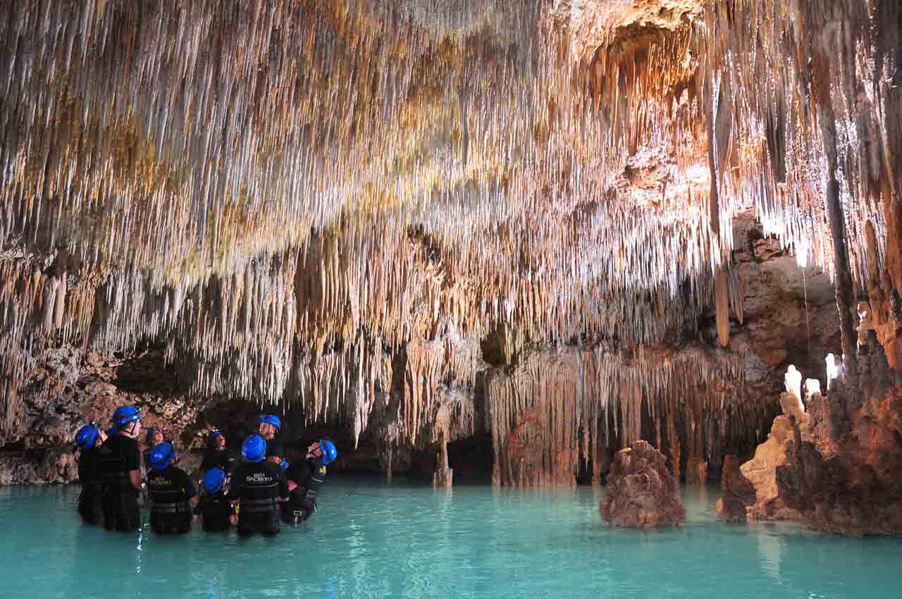 group-of-possessed-tourists-staring-up-at-stalactites-during-rio-secreto-reserve-tour