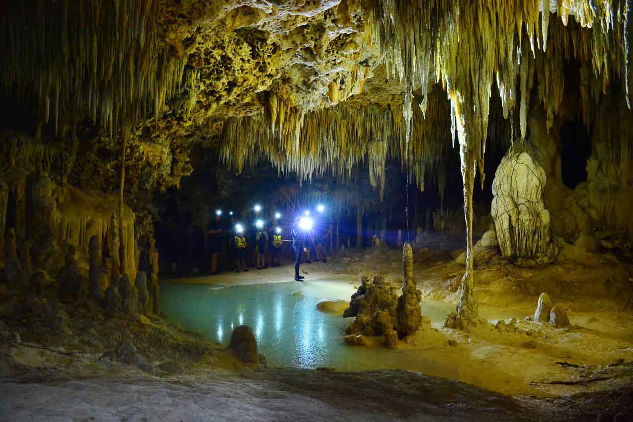 large-group-of-guests-taking-tour-of-rio-secreto-in-riviera-maya