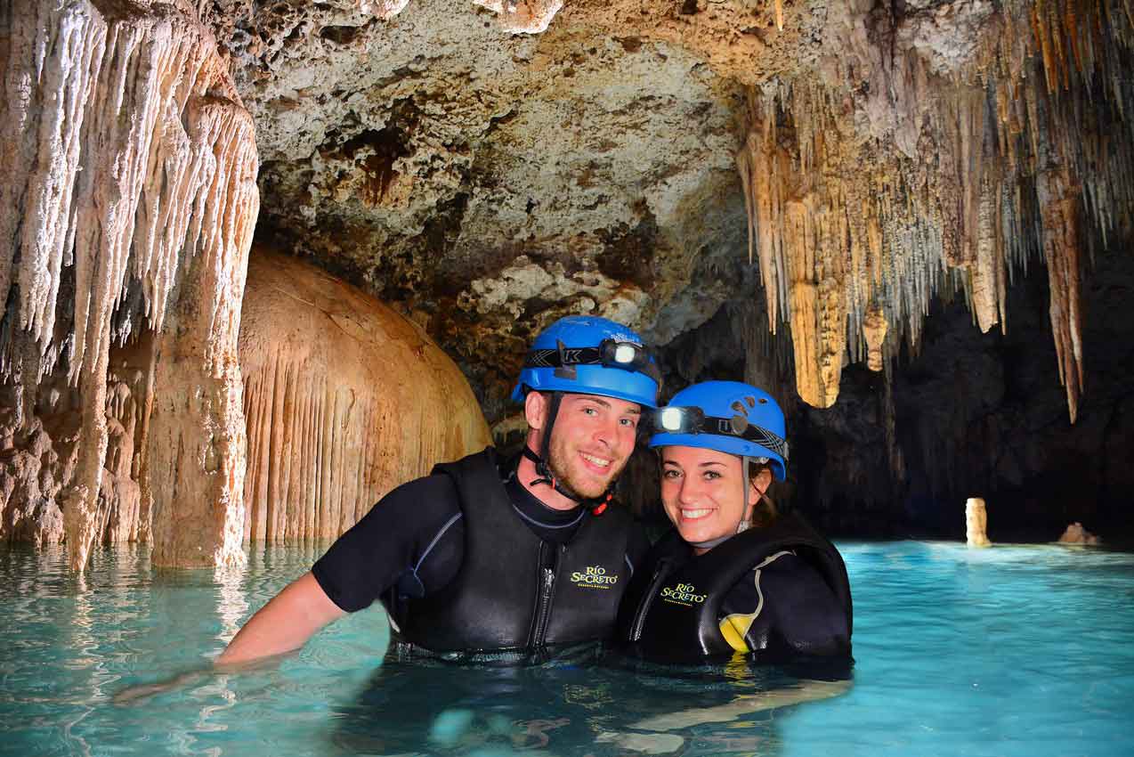 man-and-woman-smiling-in-cave-during-rio-secreto-tour