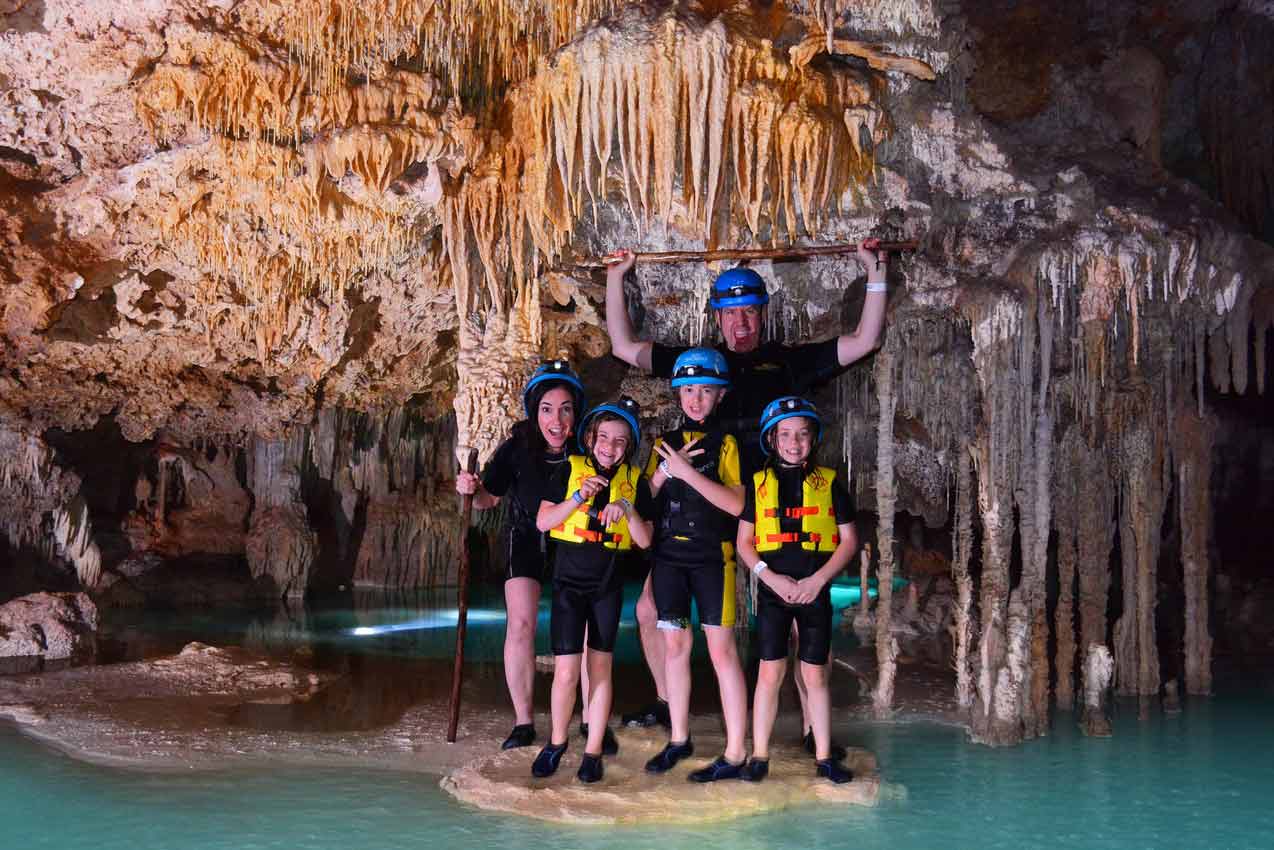 mother-father-kids-enjoying-rio-secreto-cenote-and-cave-tour