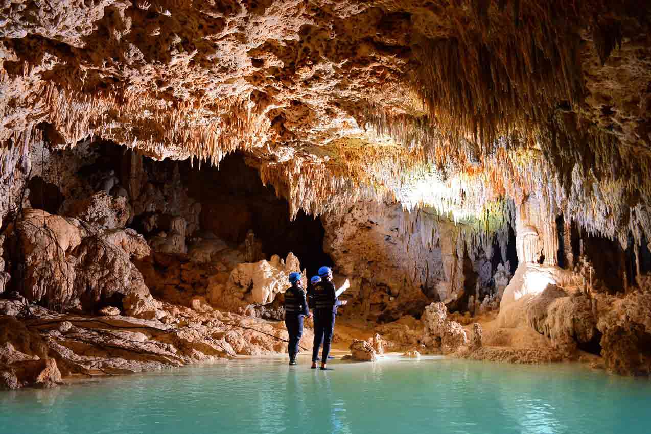 rio-secreto-riviera-maya-tourists-and-guide-in-very-large-underground-cavern-looking-upwards