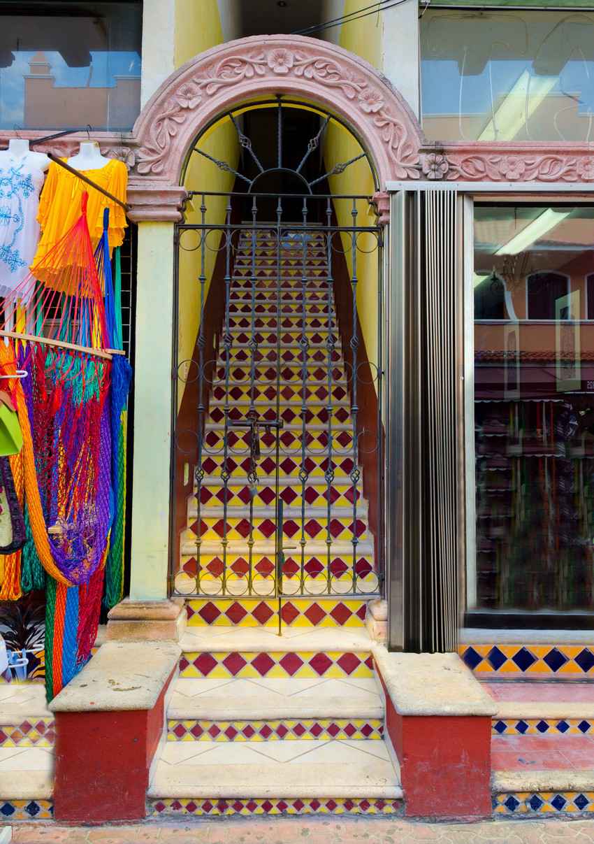 A colorful stairway leading to a hotel entrance.