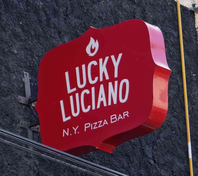 Lucky Luciano New York pizza bar sign.