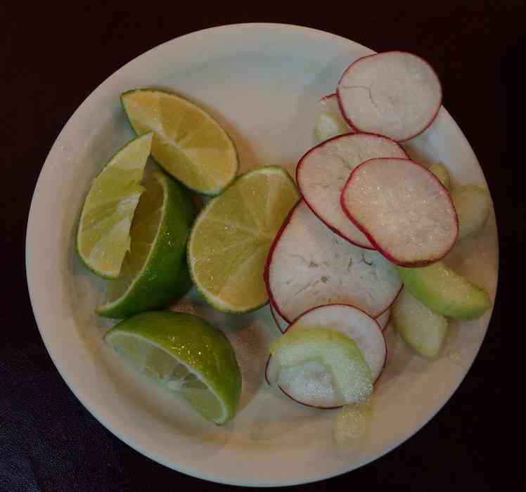 Radishes, cucumbers, and limes served with a meal at the famous El Fogon restaurant in Playa Del Carmen.
