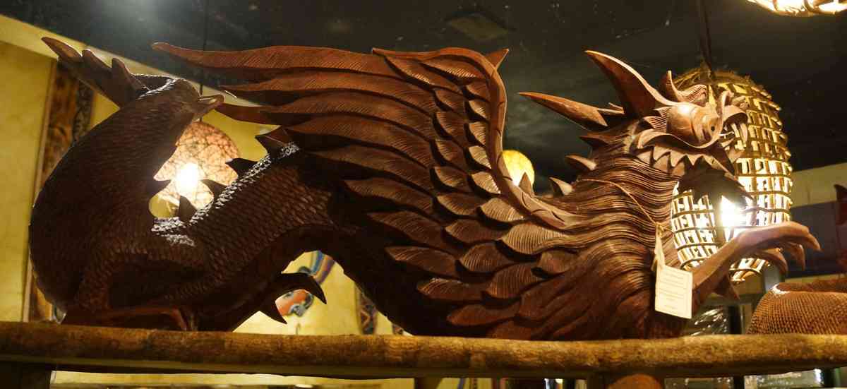 A wooden dragon sculpture.