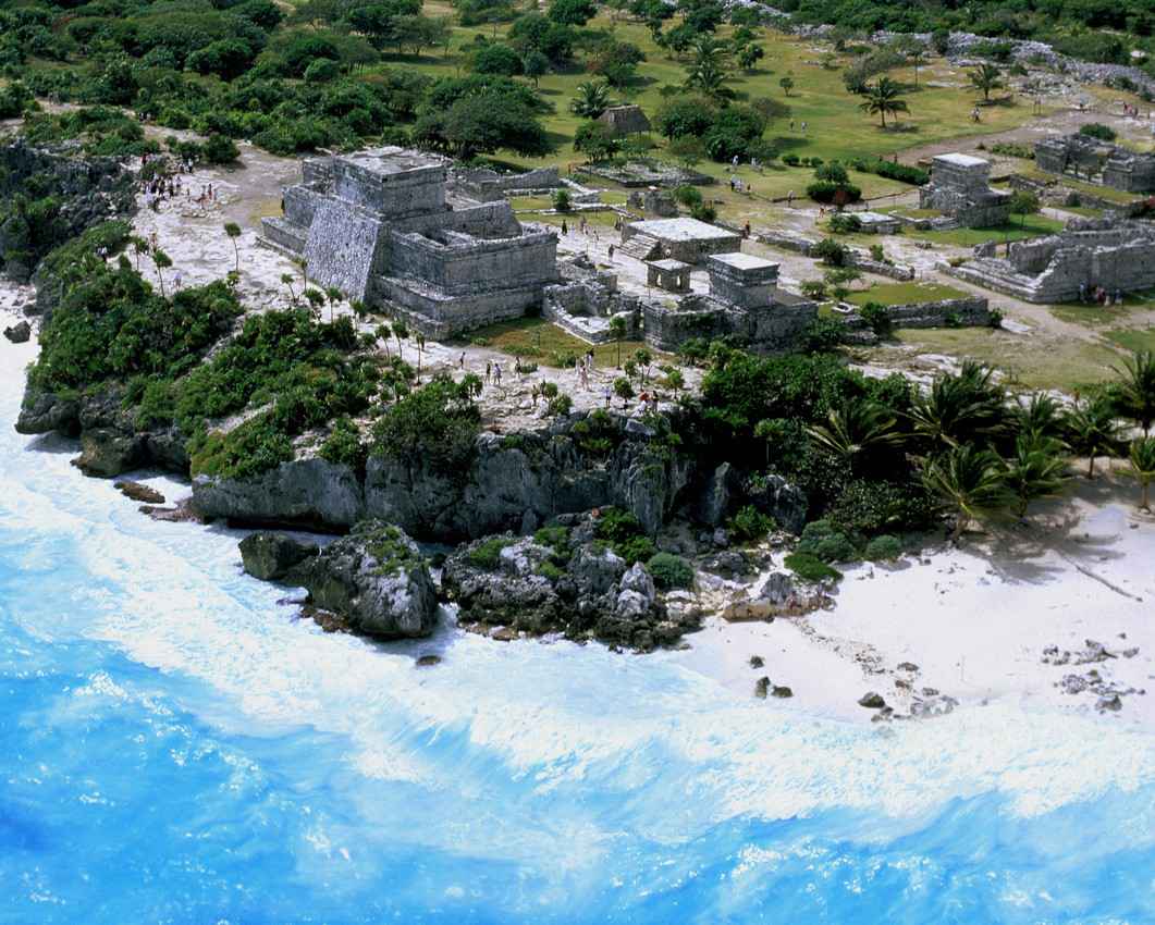 An aerial view of the front of the Tulum ruins and beach.