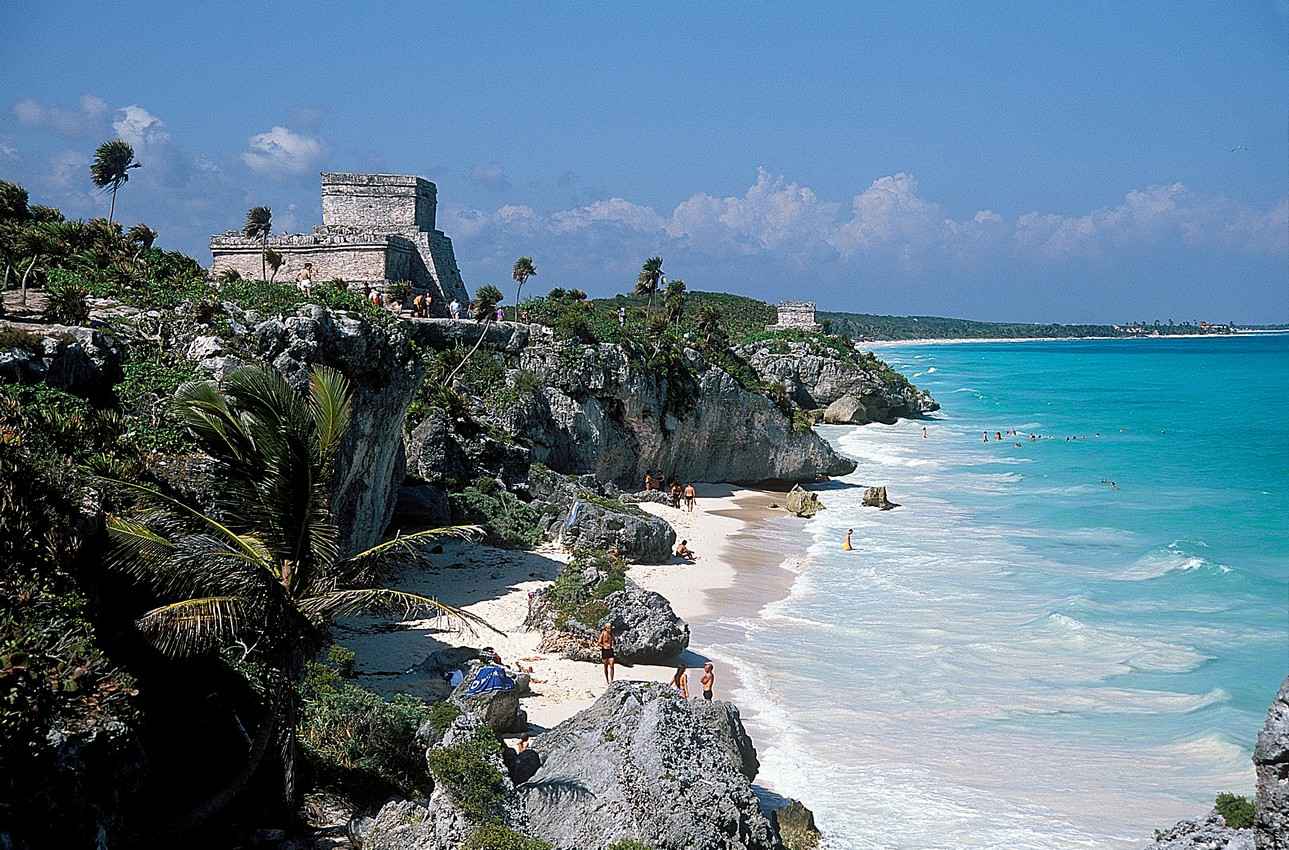 Crystal clear blue waters next to the Tulum ruins and beach.