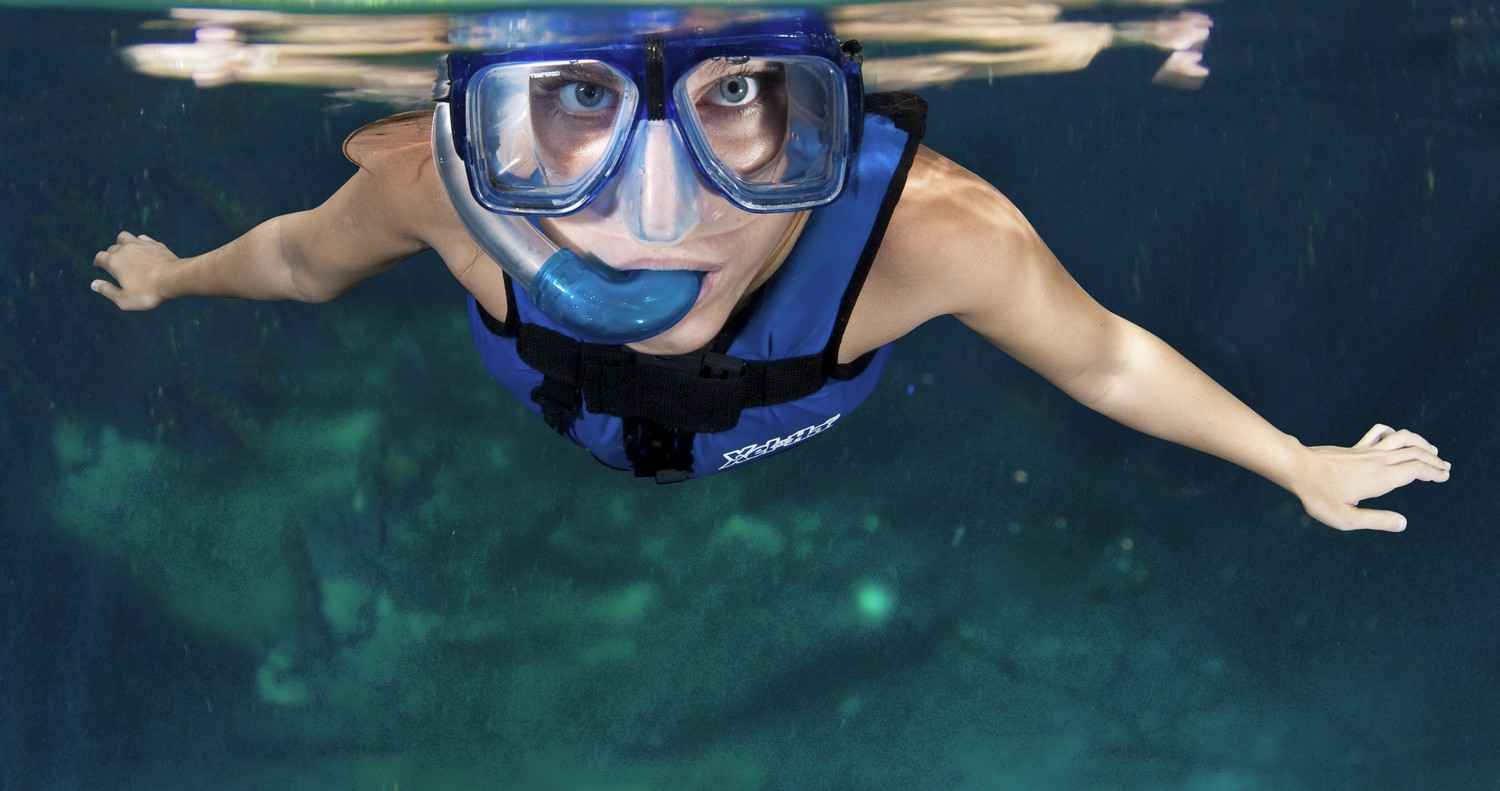 A woman snorkeling at the park.