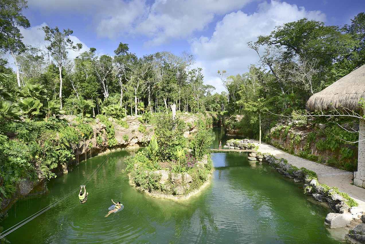 The cenote tourist attraction as seen on a beautiful day.