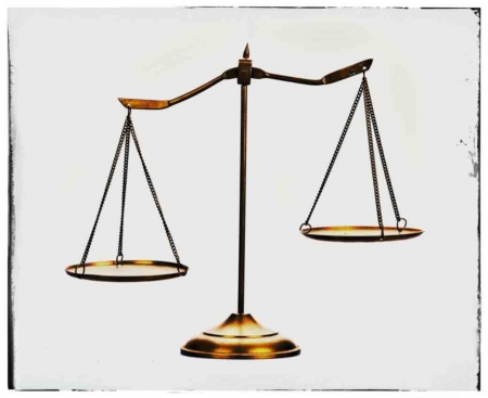 A scale of justice with a white background and frame.