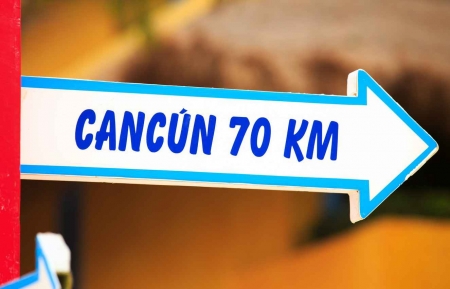 Cancun and 70 km sign.