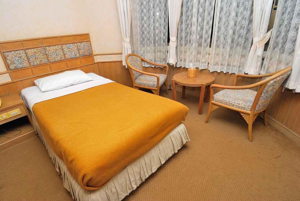 A single room with one double bed.