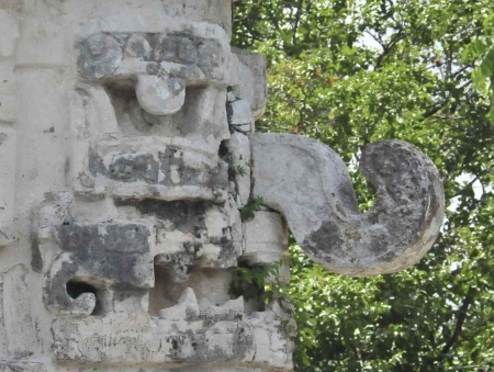 A strange and scary Mayan face on the side of the ruins at Chichen Itza.