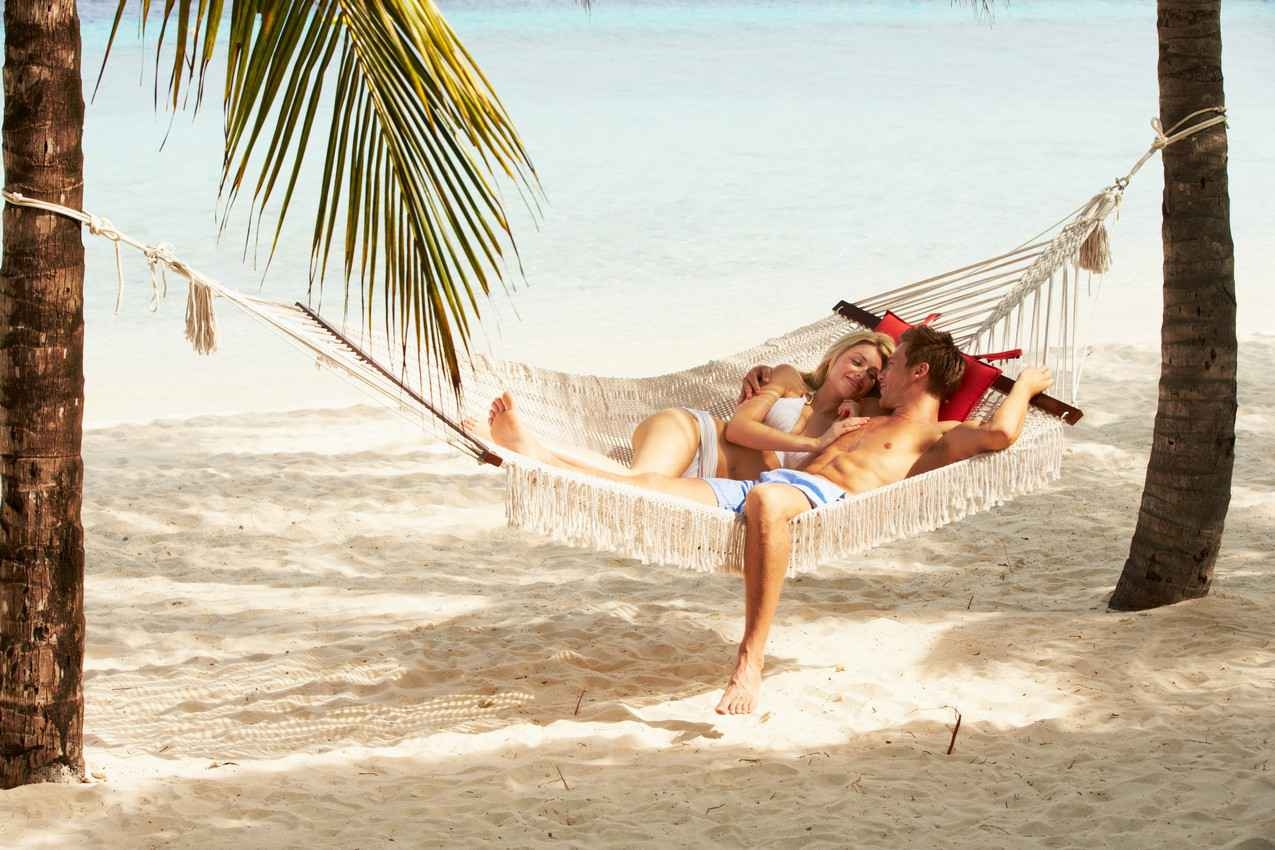 Living the easy life in a hammock on the beach.