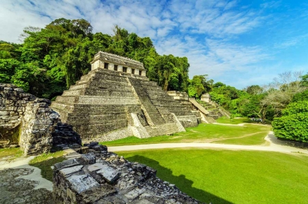 A beautifully maintained Mayan pyramid in the jungle.