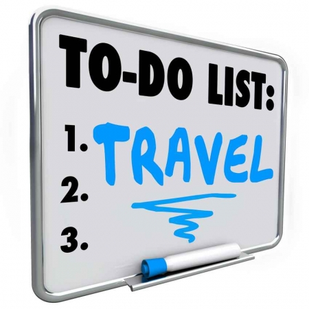 A travel to do list on a whiteboard.