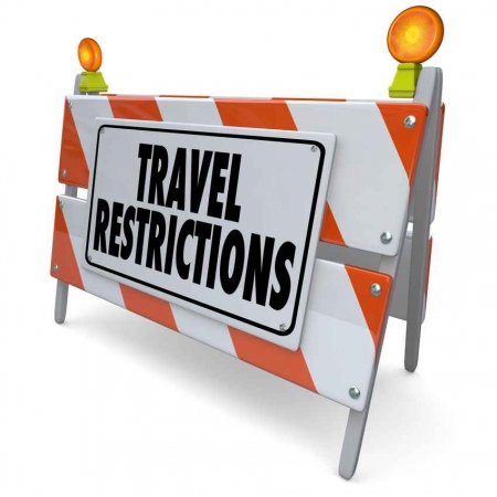 Travel restrictions road sign.