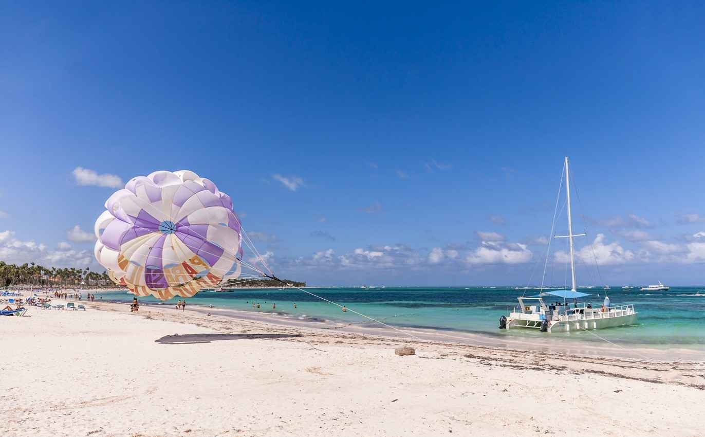 A parasail blowing in the wind on a beach in Playa Del Carmen.