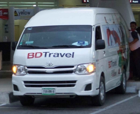 A Playa Del Carmen travel transfer van at the Cancun international Airport.