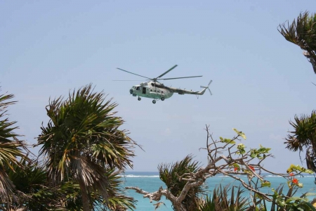 A large helicopter near a beach in Playa Del Carmen.