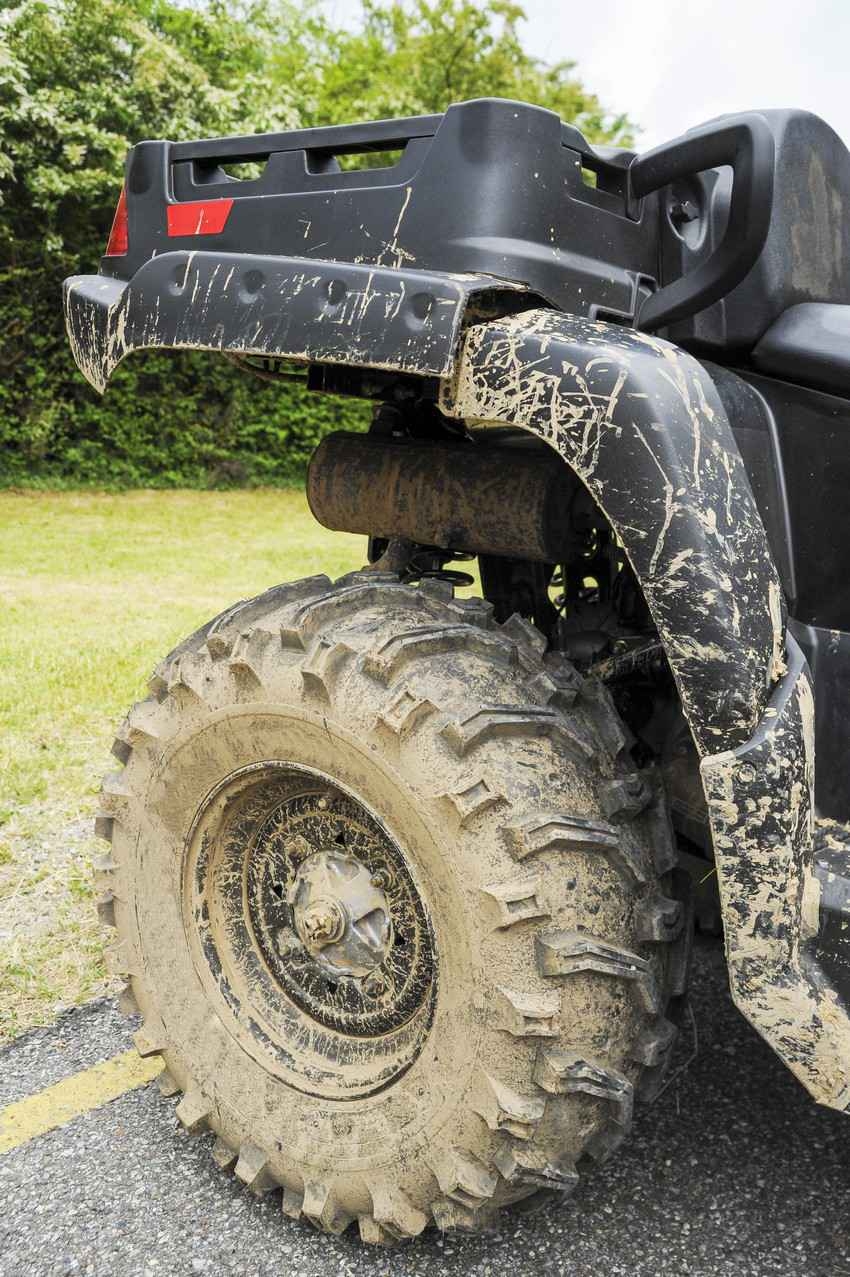 A very muddy ATV after a tour.