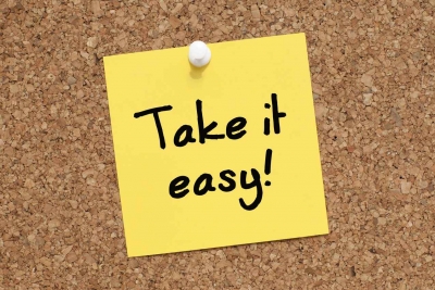 A Post-it note that says take it easy.