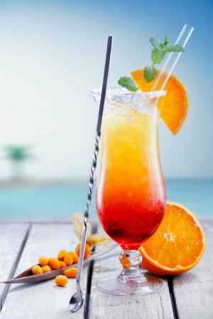 A delicious looking cocktail in front of the Caribbean Sea.