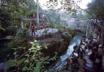 A group of men performing a Mayan ritual for tourists.