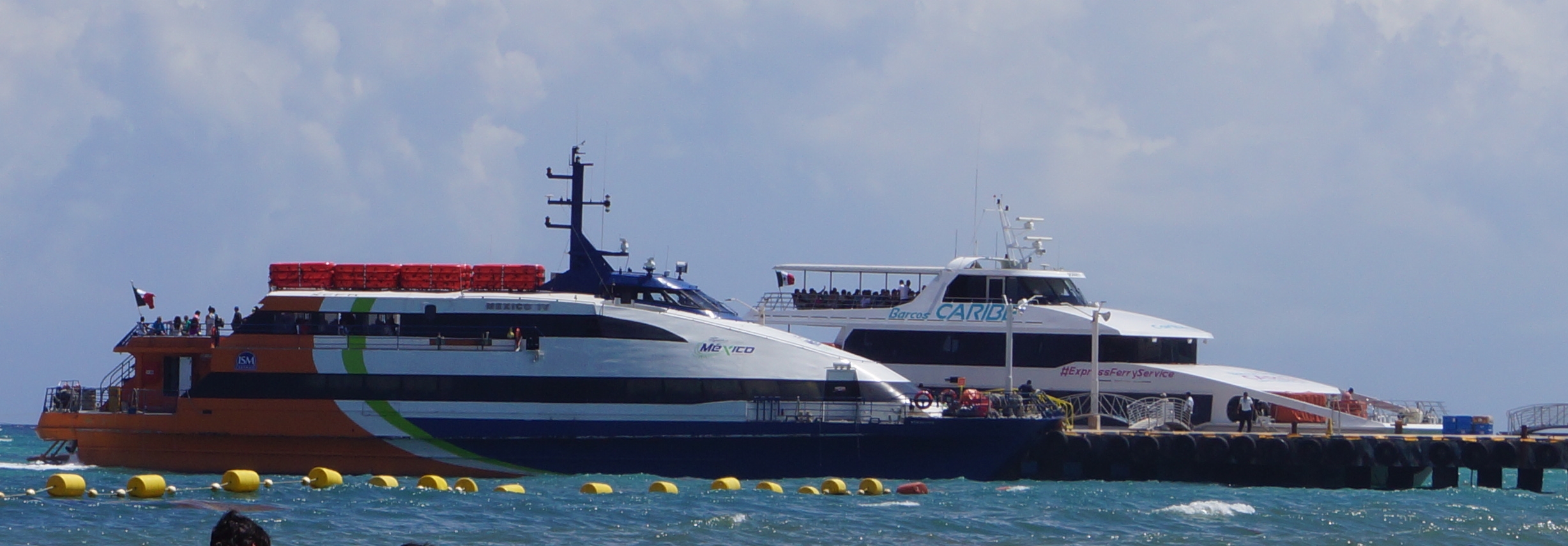 Two ferries parked at dock in Playa Del Carmen.