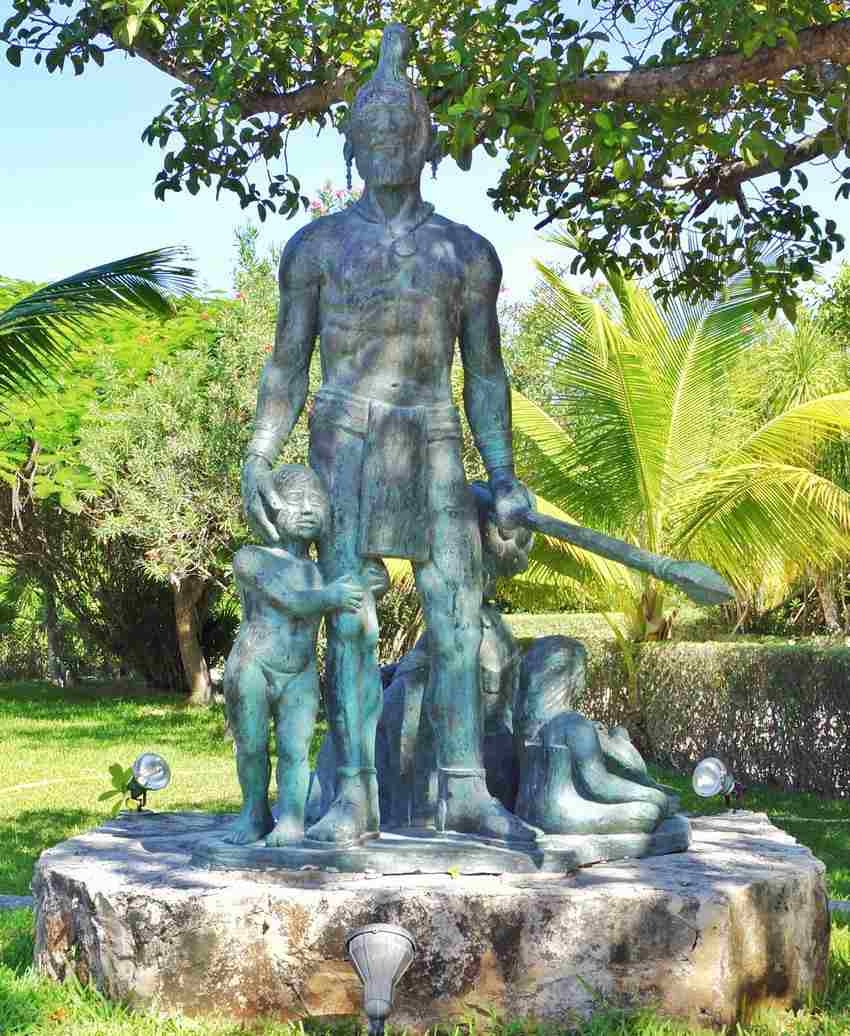A statue of a historical Mayan warrior in the Riviera Maya.