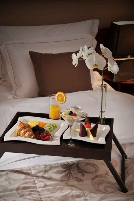 Room service in bed offered at an expensive hotel.