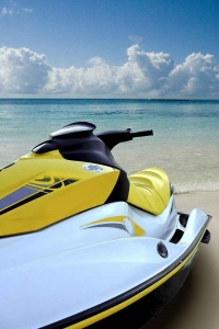 A jet ski on the beach with a label that says Playa Del Carmen.