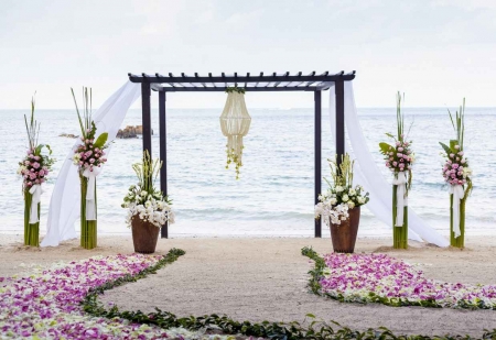 A canopy style wedding ceremony on the beach.
